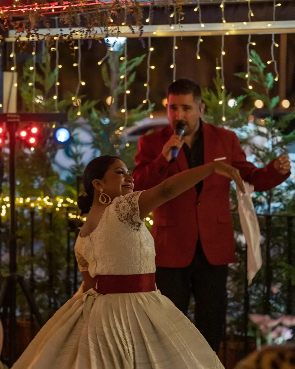 Two dancers in traditional Peruvian dress performing at Pachamama
