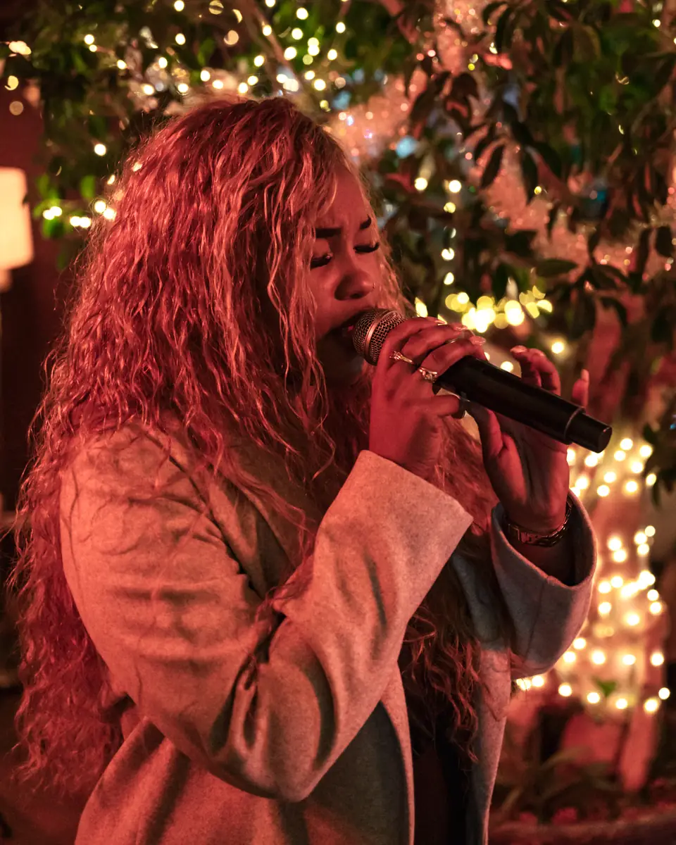 A singer under a spotlight on the Pachamama terrace