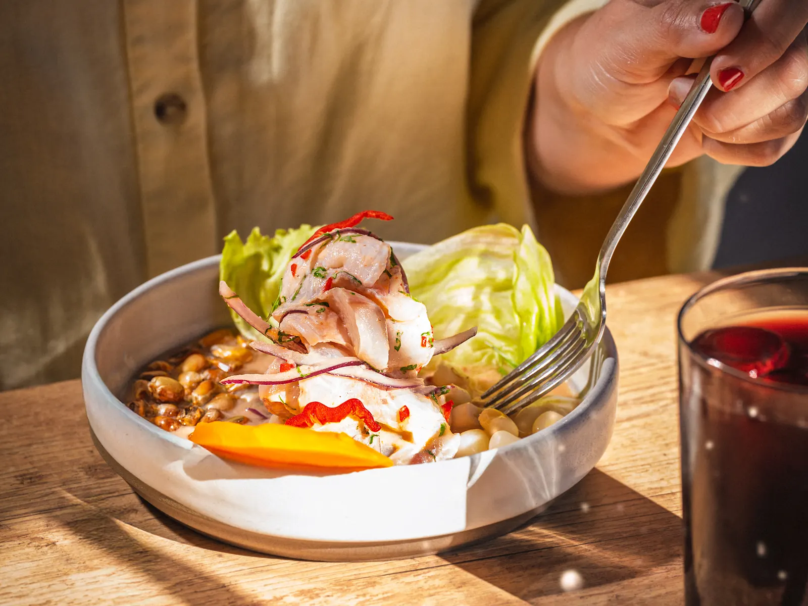 Pachamama ceviche de lubina with camote, choclo, cancha and red onion