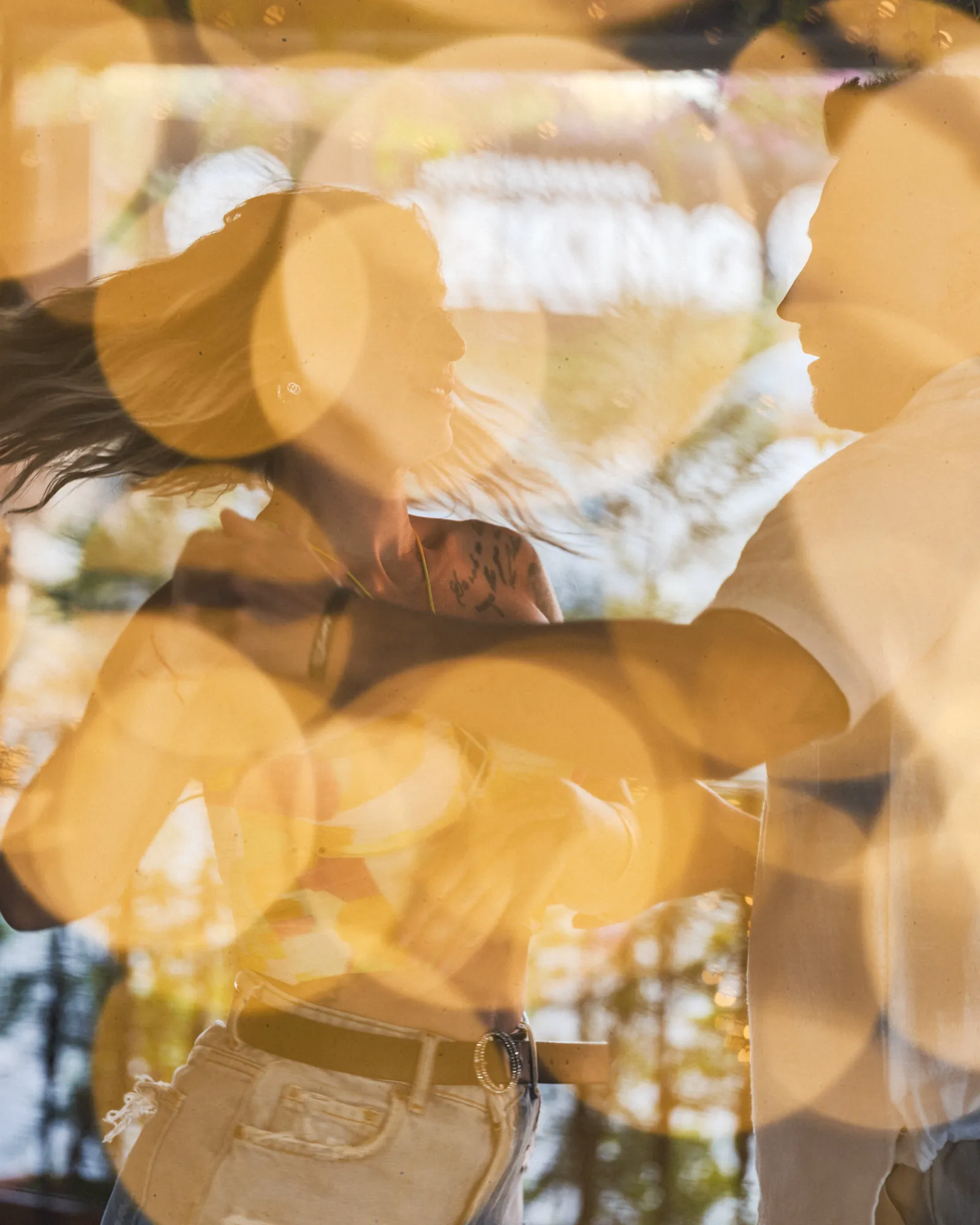 Couples dancing on the terrace at Pachamama, lanterns out of focus around them