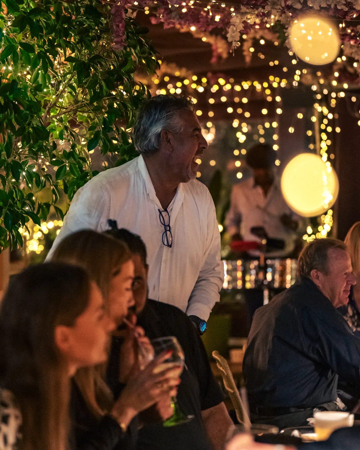 Guests together at a group celebration on the terrace at Pachamama